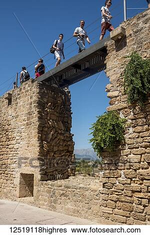 Tourists walking over the city wall; Alcudia, Mallorca, Balearic Islands, Spain View Large Photo Image Stock Photograph - Tourists walking over the city wall; Alcudia, Mallorca, Balearic Islands, Spain. Fotosearch