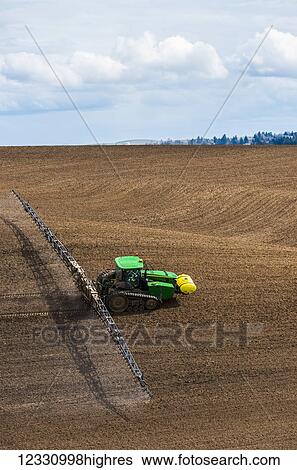 Track Tractor Configured With Spraying Booms Spraying Fertilizer On A Garbonzo Bean Seedbed In The Palouse Region Of Eastern Washington; Washington, United States Of America View Large Photo Image Stock Photograph - Track Tractor Configured With Spraying Booms Spraying Fertilizer On A Garbonzo Bean Seedbed In The Palouse Region Of Eastern Washington; Washington, United States Of America. Fotosearch