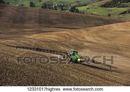 Track Tractor Configured With Spraying Booms Spraying Fertilizer On A Garbonzo Bean Seedbed In The Palouse Region Of Eastern Washington; Washington, United States Of America View Large Photo Image Stock Photograph - Track Tractor Configured With Spraying Booms Spraying Fertilizer On A Garbonzo Bean Seedbed In The Palouse Region Of Eastern Washington; Washington, United States Of America. Fotosearch