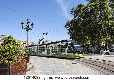 Stock Photograph - Tranvia, an electric train on tracks on a street; Bilbao, Vizcaya, Pais Vasco, Spain. Fotosearch