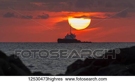 Tugboat in sunset viewed from Magic Island, Ala Monana beach park; Honolulu, Oahu, Hawaii, United States of America View Large Photo Image Stock Photograph - Tugboat in sunset viewed from Magic Island, Ala Monana beach park; Honolulu, Oahu, Hawaii, United States of America. Fotosearch