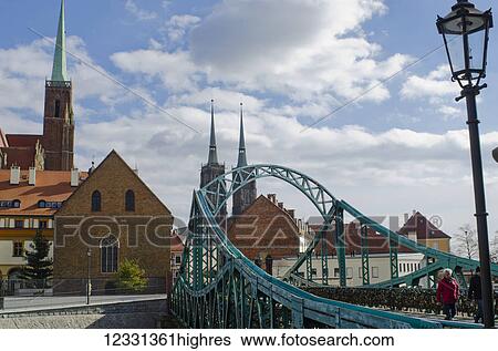 Stock Photograph - Tumski Bridge And Lovers Locks With Spires Of Cathedral In The Background; Wroclaw, Lower Silesia, Poland. Fotosearch
