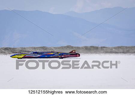 Stock Photograph - Turbine Streamliner Class T3/T 1988 Streamliner, Allison Turbine of Team Vesco at speed attempting breaking 427. 832 mph record on Bonneville Salt Flats during Bonneville Speed Week 2017; Wendover, Utah, United States of America. Fotosearch