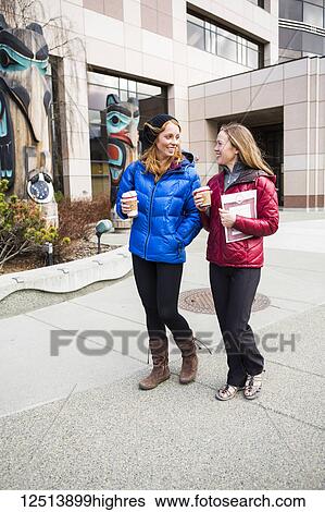 Two young women hanging out in downtown Anchorage, South-central Alaska; Anchorage, Alaska, United States of America View Large Photo Image Stock Photograph - Two young women hanging out in downtown Anchorage, South-central Alaska; Anchorage, Alaska, United States of America. Fotosearch