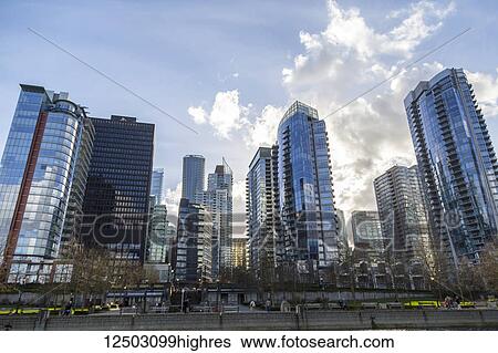 Vancouver city skyline from the coal harbour waterfront, looking up towards the luxury real estate condos and hotels; Vancouver, British Columbia, Canada View Large Photo Image Stock Photograph - Vancouver city skyline from the coal harbour waterfront, looking up towards the luxury real estate condos and hotels; Vancouver, British Columbia, Canada. Fotosearch