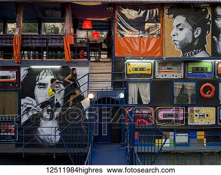 Stock Photograph - Various large pieces of artwork representing popular culture from the 80's decade on a wall; Belgrade, Vojvodina, Serbia. Fotosearch