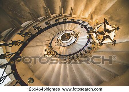View directly up of a spiral staircase and chandeliers, Duino Castle; Trieste, Friuli Venezia Giulia, Italy View Large Photo Image Stock Photograph - View directly up of a spiral staircase and chandeliers, Duino Castle; Trieste, Friuli Venezia Giulia, Italy. Fotosearch