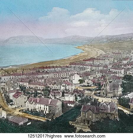 Stock Photograph - View from Great Orme's Head of the hills of Penmsenmawr, Anglesey, Puffin Island and the town below, North Wales in the United Kingdom; Wales. Fotosearch