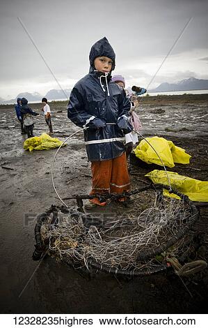 Stock Photograph - Volunteers Cleaning Up The Beach, Homer, Kenai Peninsula, Alaska, USA. Fotosearch