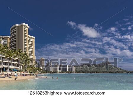 Stock Photograph - Waikiki Beach with Diamond head on the horizon, Waikiki; Honolulu, Oahu, Hawaii, United States of America. Fotosearch