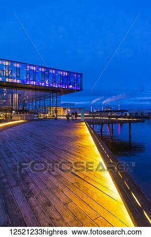 Stock Photograph - Walkway leading to The Royal Danish Playhouse at dusk; Copenhagen, Denmark. Fotosearch