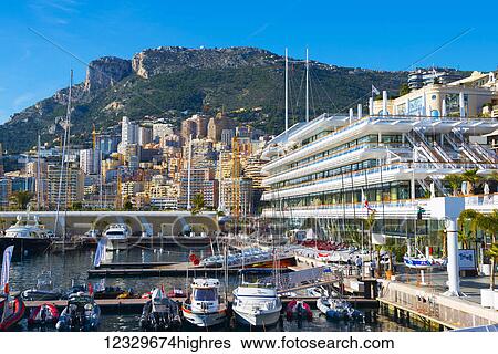 Stock Photograph - Waterfront With Buildings And Boats In The Harbour; Monte Carlo, Monaco. Fotosearch