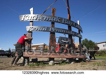 Stock Photograph - Welder And Metal Work Artist Doug Schwiesow Working On A Custom Sign Designed With A Local Artist For The Kenai Peninsula College Kachemak Bay Campus.. Fotosearch