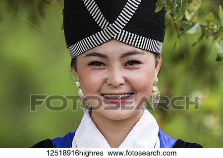 Stock Photograph - Woman in traditional costume, Plain of Jars; Xiangkhouang, Laos. Fotosearch