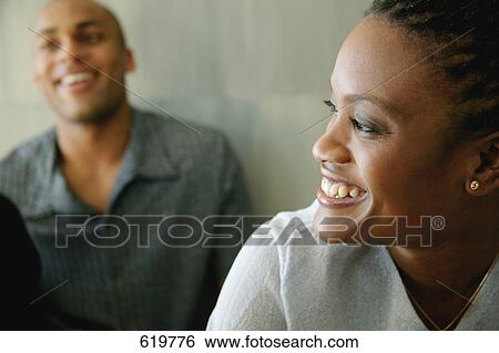 Woman listens to man View Large Photo Image Stock Photograph - Woman listens to man. Fotosearch