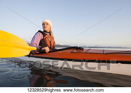 Woman sea kayaking in Kachemak Bay, near Homer, South-central Alaska; Alaska, United States of America View Large Photo Image Stock Photograph - Woman sea kayaking in Kachemak Bay, near Homer, South-central Alaska; Alaska, United States of America. Fotosearch