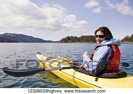 Woman sea kayaking in Kachemak Bay, near Homer, South-central Alaska; Alaska, United States of America View Large Photo Image Stock Photograph - Woman sea kayaking in Kachemak Bay, near Homer, South-central Alaska; Alaska, United States of America. Fotosearch