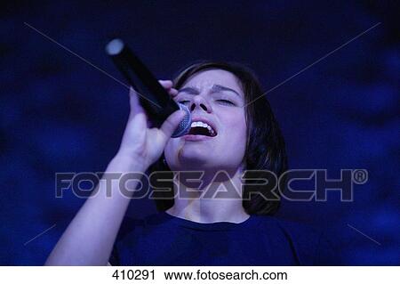 Woman singing View Large Photo Image Stock Image - Woman singing. Fotosearch