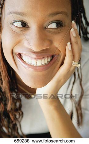 Woman smiles View Large Photo Image Stock Photo - Woman smiles. Fotosearch