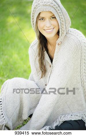 Woman wearing a knit beige cape View Large Photo Image Stock Photography - Woman wearing a knit beige cape. Fotosearch