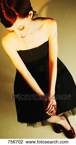 Woman wearing strapless dress View Large Photo Image Stock Image - Woman wearing strapless dress. Fotosearch
