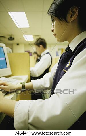 Stock Image - Working in class. Fotosearch