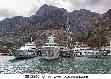 Stock Photograph - Yachts mooring in the harbour in the Bay of Kotor; Kotor, Monte. Fotosearch