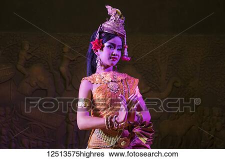 Stock Photograph - Young woman performing the Blessing Dance in a Khmer classical dance performance; Siem Reap, Cambodia. Fotosearch