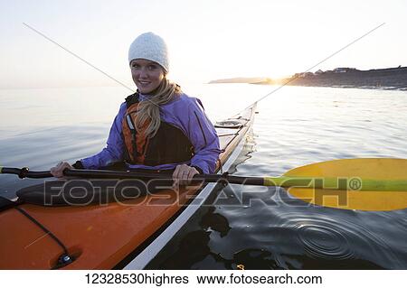 Young woman sea kayaking in Kachemak Bay, near Homer, South-central Alaska; Alaska, United States of America View Large Photo Image Stock Photograph - Young woman sea kayaking in Kachemak Bay, near Homer, South-central Alaska; Alaska, United States of America. Fotosearch