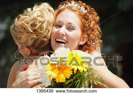 Stock Photo - A hug of congratulations. Fotosearch