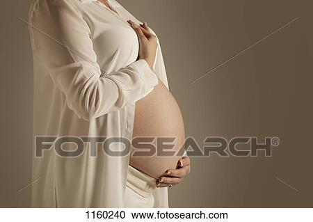 Stock Image - A pregnant belly. Fotosearch