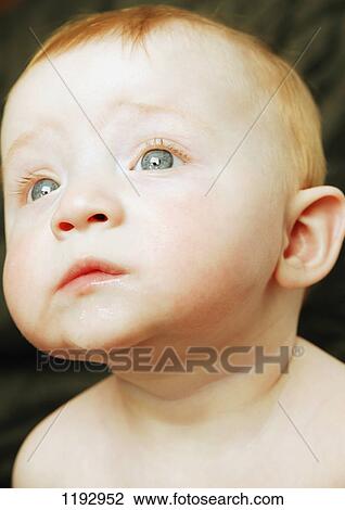 Stock Image - Baby deep in thought. Fotosearch