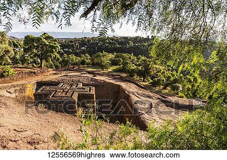 Stock Photograph - Biete Ghiorgis (House of Saint George) Ethiopian Orthodox underground monolith rock-cut church in the Northern Group of the Rock-Hewn Churches; Lalibela, Amhara Region, Ethiopia. Fotosearch