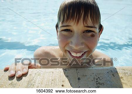 Boy in swimming pool View Large Photo Image Stock Image - Boy in swimming pool. Fotosearch