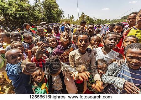 Stock Photograph - Boys in a Timkat procession during the Orthodox Tewahedo celebration of Epiphany, celebrated on January 19th; Sodo, Southern Nations Nationalities and Peoples' Region, Ethiopia. Fotosearch
