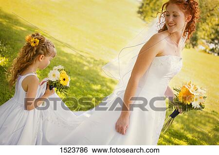 Bride and flower girl View Large Photo Image Stock Photograph - Bride and flower girl. Fotosearch