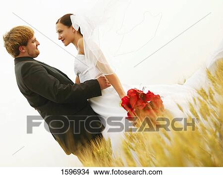 Picture - Bride and groom share a gaze. Fotosearch