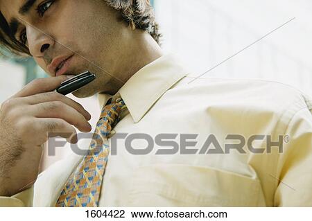 Stock Image - Businessman concentrates. Fotosearch