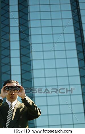Businessman looks into the future View Large Photo Image Stock Image - Businessman looks into the future. Fotosearch