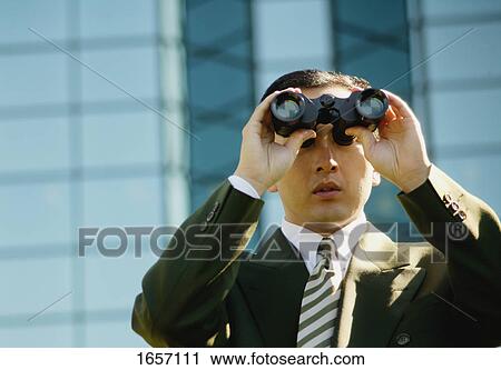 Businessman looks into the future View Large Photo Image Stock Image - Businessman looks into the future. Fotosearch