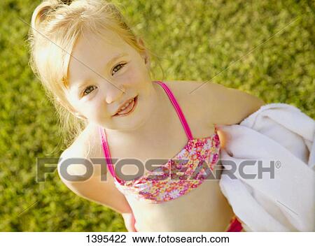 Child with bathing suit and towel View Large Photo Image Stock Image - Child with bathing suit and towel. Fotosearch
