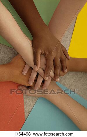 Stock Photo - Children put their hands together. Fotosearch