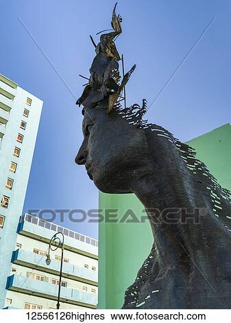Contemporary sculpture of a woman's head and shoulder against a blue sky; Havana, Cuba View Large Photo Image Stock Photograph - Contemporary sculpture of a woman's head and shoulder against a blue sky; Havana, Cuba. Fotosearch