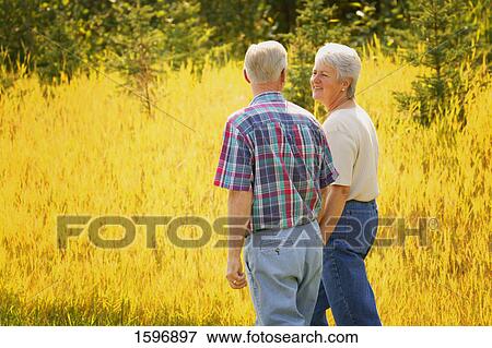 Stock Photo - Couple go for a walk. Fotosearch