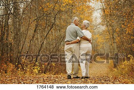Stock Photo - Couple go for a walk. Fotosearch