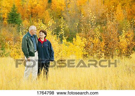 Stock Photo - Couple go for a walk. Fotosearch