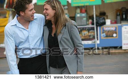 Couple sharing a laugh View Large Photo Image Stock Image - Couple sharing a laugh. Fotosearch