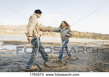 Couple take a step closer View Large Photo Image Picture - Couple take a step closer. Fotosearch