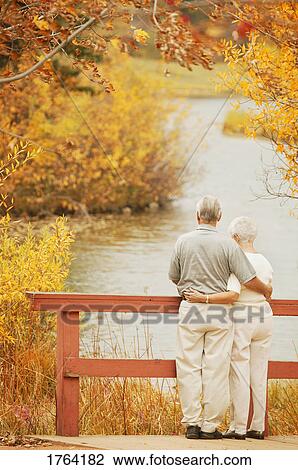 Couple take in the scenery View Large Photo Image Stock Image - Couple take in the scenery. Fotosearch