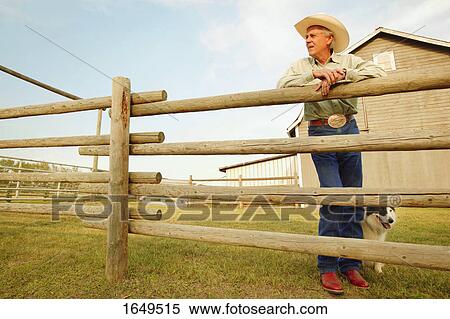 Cowboy on a ranch View Large Photo Image Stock Photography - Cowboy on a ranch. Fotosearch